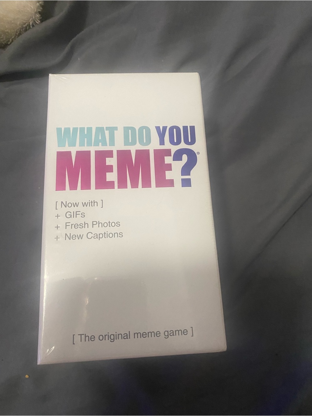 Source Unknown What Do You Meme? Game - White with Pink and Blue Logo